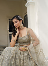 Symbolic Looking Wedding Wear Ivory Colour Lehenga Choli